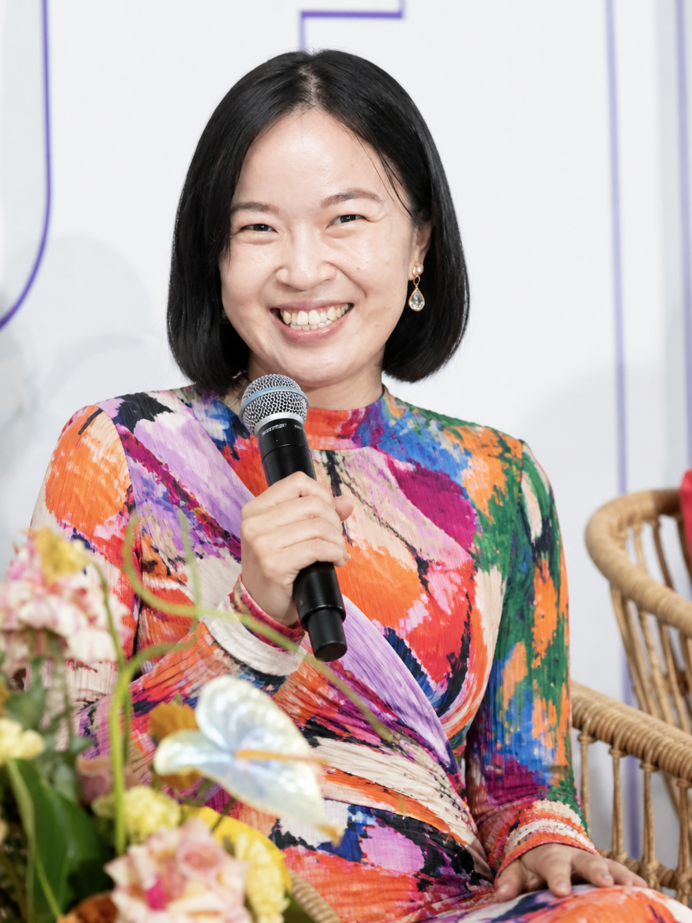 Soh Wan Wei on stage with a microphone