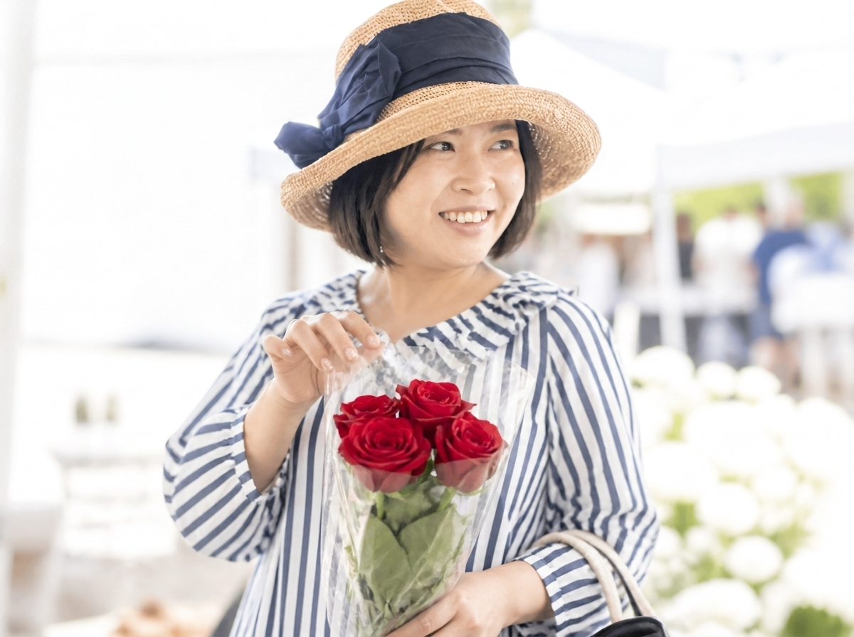 Soh Wan Wei at a flower market, holding red roses