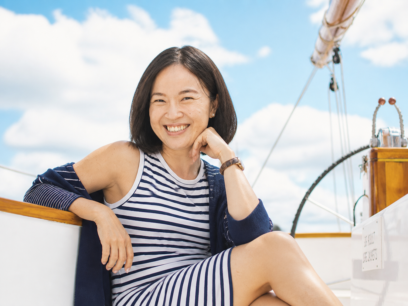 Soh Wan Wei on a sailboat under a clear sky — at ease, at the helm of her own course.